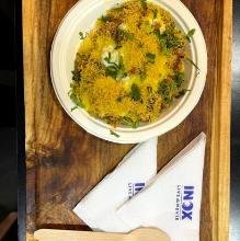 Indian street food served at a cinema counter